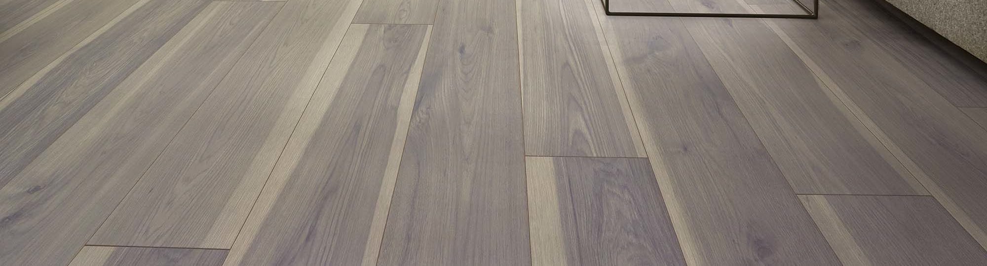 A living room with brown wooden flooring