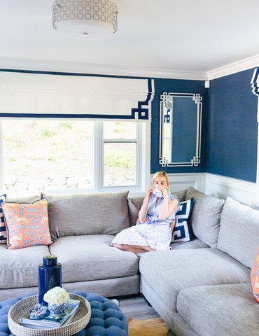 modern living room drinking tea on a sofa